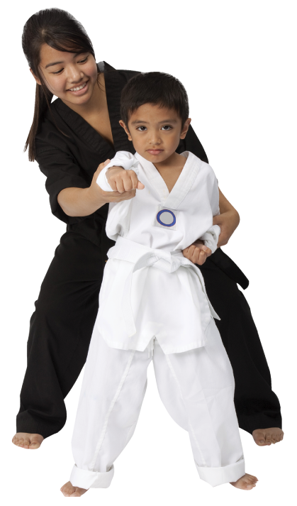 little boy with martial arts instructor