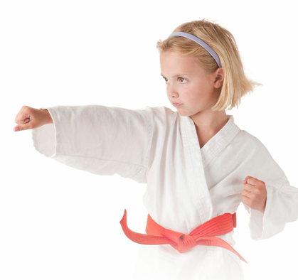 little girl doing martial arts punch